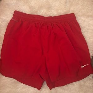 Nike red and yellow dri-fit athletic shorts